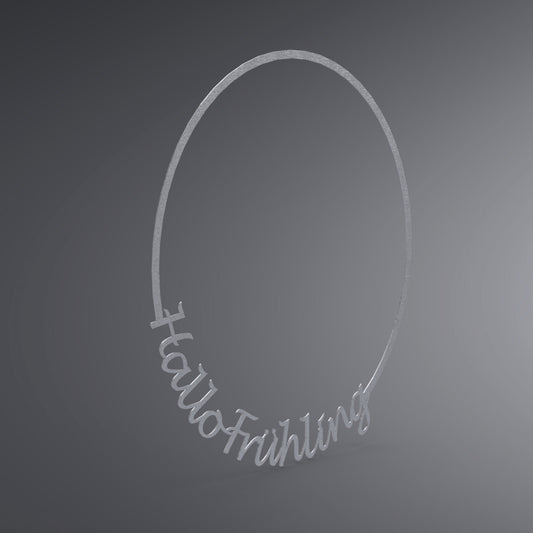 Dünner, ausgehöhlter Kreis. Am unteren Rand steht: "Hallo Frühling". Seitliche Ansicht.