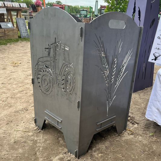 Große Feuertonne mit einem Trecker und einer Gerste auf der anderen Seite.