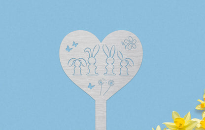 In einem Herz sind viele kleine Hasen Silhouetten 